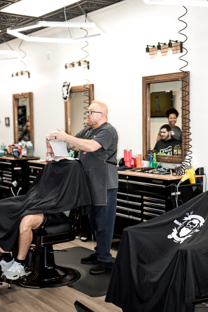 Barber cutting a client’s hair.