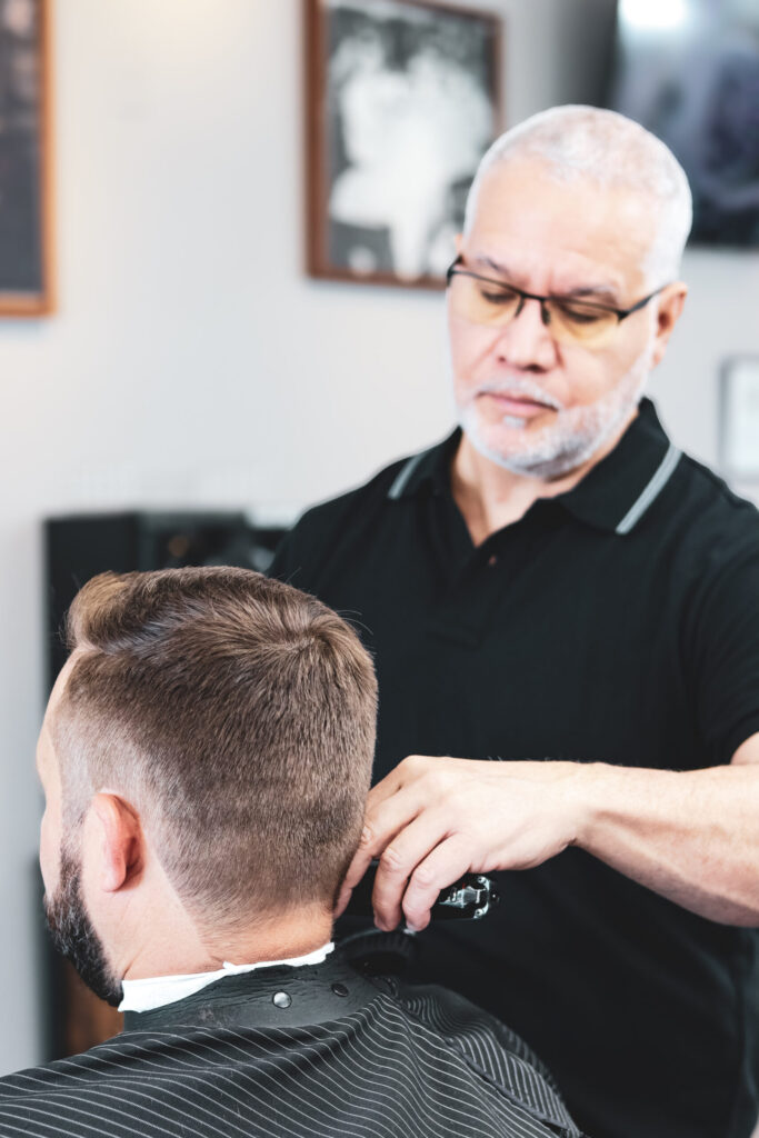 Barber cutting a client’s hair.