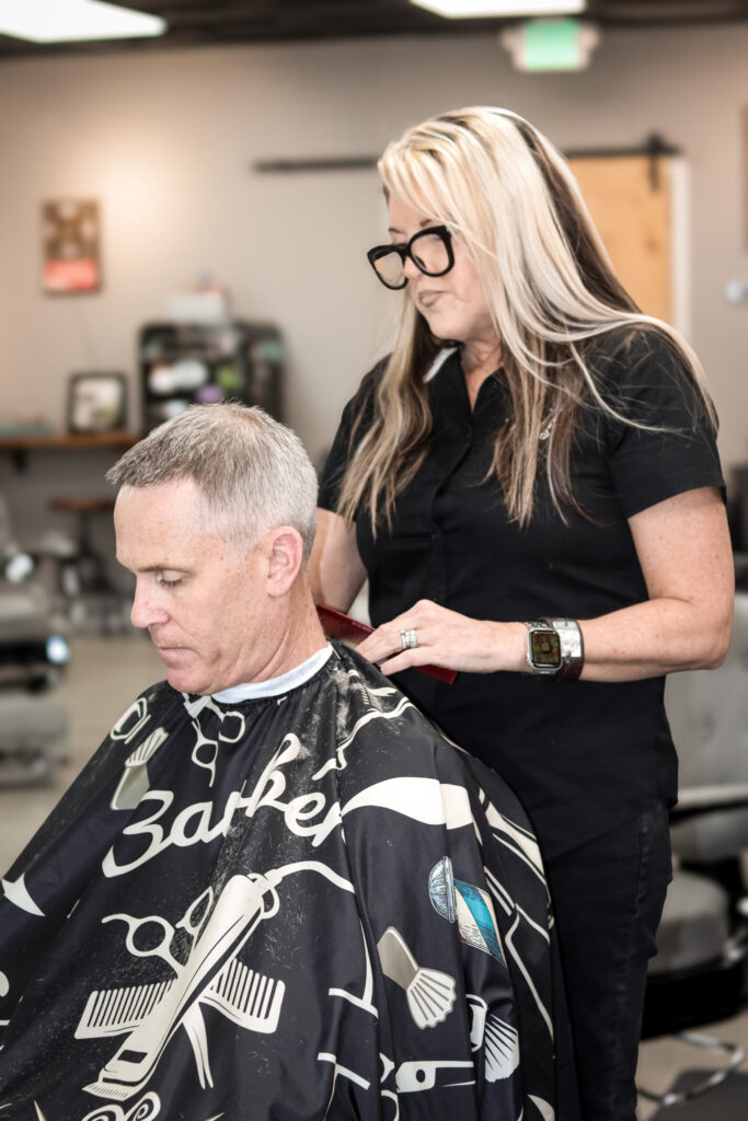 Barber cutting a client’s hair.